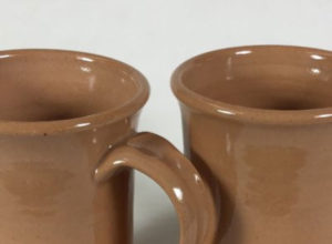 Two clay-based coffee cups