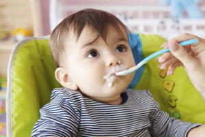 Baby being fed with a spoon