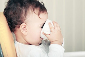 Baby drinking out of a cup