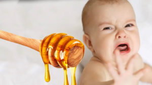 Baby crying next to image of a honey dripper