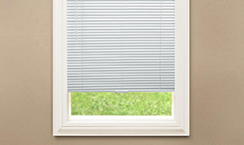 Window with white vinyl blinds
